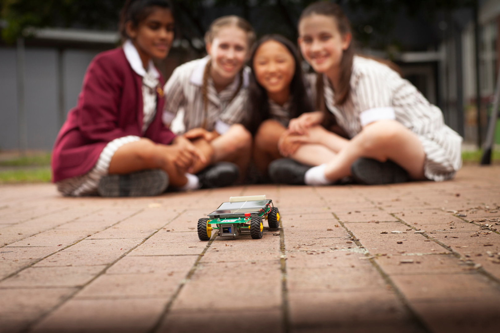 Solar Car With Four Female Students Blurred Un Background